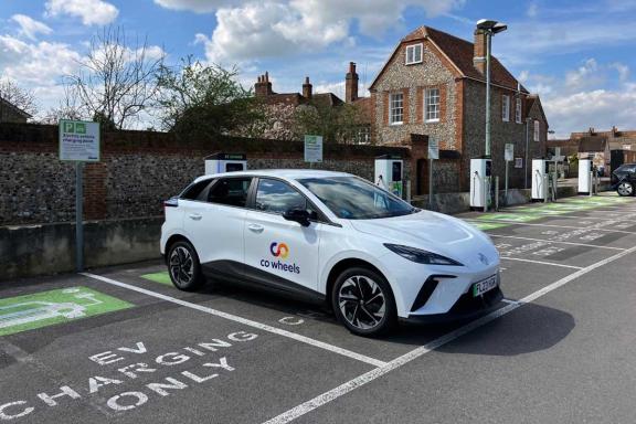 photo of a co wheels electric car parked in a chargepoint space