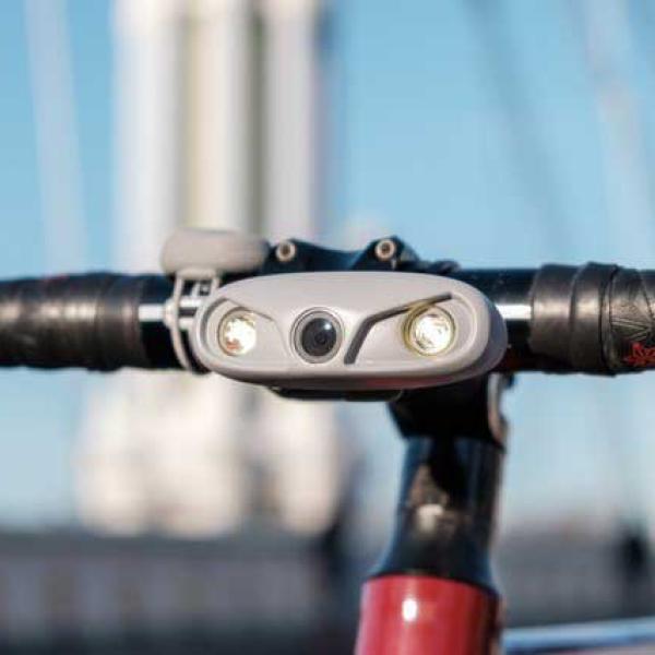 smart bike light on the handlebars of a bike
