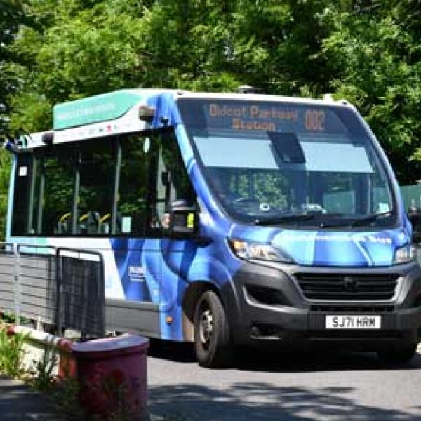 autonomous minibus driving over a bridge
